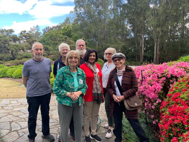 Photo of group members with azaleas