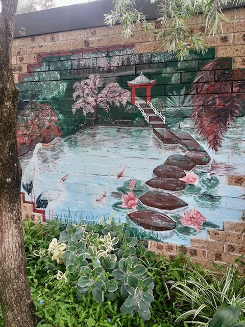 Photo of mural on a garden wall